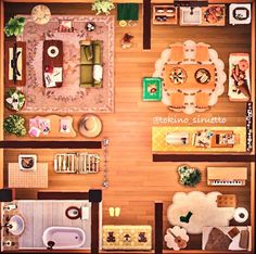 an overhead view of a living room and dining area in a dollhouse with furniture