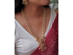 Embrace tradition with this gold-tone long haram set. Kemp stones, crystals & pearls adorn the ruby red and green stone  & elaborate guttapusalu design. A statement piece for the modern South Indian bride. #traditionalnecklace #templejewelry #southindianjewelry Necklace and Earrings Necklace Has Been Adjustable Cord Push Back Earrings Length Of Earrings - 1.5 Inches Gold Tone , Pearl , Kemp Stone , Bead Handmade Necklace Gold Necklace *SHOP LINK - https://www.etsy.com/shop/ColourstoneWorld?ref=profile_header * PERFECT GIFT FOR LOVED ONES DELIVERY UPGRADE AVAILABLE IF YOU HAVE ANY QUESTIONS PLEASE FEEL FREE TO ASK We Can Take Custom Orders Also As Per Your Requirement. ColourstoneWorld Jewelry Pieces Can Be Customized As Per Your Requirement. SHOP LINK - https://www.etsy.com/shop/Colourston Diwali Temple Jewelry Necklace With Pearl Chain, Celebration Temple Jewelry Necklace With Pearl Chain, Diwali Temple Necklace With Pearl Chain, Temple Style Pearl Chain Necklace For Puja, Temple Jewelry Pearl Chain Necklace For Puja, Temple Style Necklace With Pearl Chain For Puja, Temple Style Pearl Chain Necklace, Festive Temple Necklace With Pearl Chain For Diwali, Festive Diwali Temple Necklace With Pearl Chain