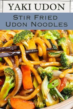 stir fried udon noodles with broccoli and carrots in a white bowl