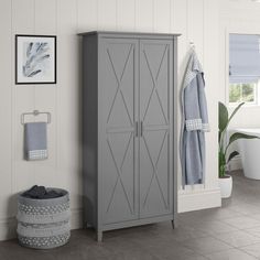 a gray cabinet sitting next to a bath tub