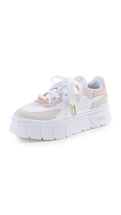 PRICES MAY VARY. Rubber sole Imitation pearl accents , Gold-tone hardware , Removable insole , Debossed logo at side and back Heel: 1.5in / 40mm, Platform: 1.5in / 40mm Platform profile Mayze Stack Edgy Pearl Sneakers Pearl Sneakers, Designer Sneakers Women, White Marshmallows, White Platform Sneakers, Debossed Logo, White Platform, Sneakers Women, Puma Women, Designer Sneakers