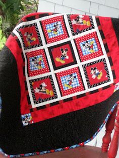 a mickey mouse quilt on a chair