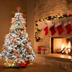 a decorated christmas tree in front of a fireplace