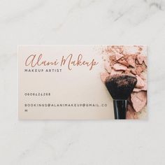 a business card with a makeup brush on it