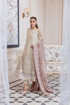 Elegant Off White Salwar Kameez in Open Style a decent Pakistani Party Dress with breathtaking artistry on it. This Pakistani Salwar Kameez is emblazoned beautifully with elegant thread work rendering it unmatched in its grace and beauty. This dress can be stitched in two styles according to the demand of our lovely customers. Kameez: This Pakistani Dress comes with a beautiful Long Kameez in premium quality chiffon. This kameez is luxuriously decorated with lavish embroidery work in floral patt Gold Salwar Kameez, White Salwar Kameez, Organza Shirt, Pakistani Salwar Kameez, Chiffon Collection, Embroidered Chiffon, Luxury Collection, Fabric Stores Online, Chiffon Shirt