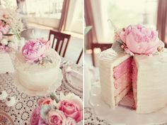 there is a cake with pink flowers on the top and one has been cut in half