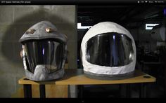 two helmets sitting on top of a wooden table