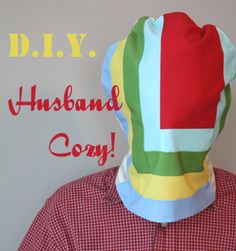 a man wearing a paper hat with the words d l y husband cozy on it