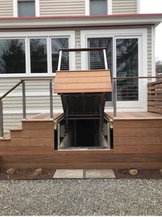 a dog house built into the side of a home