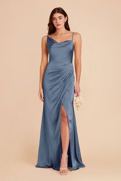 a bridesmaid in a blue dress with a slited skirt and side slit