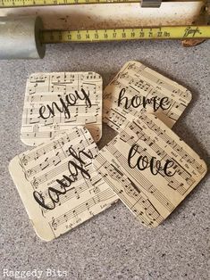 four coasters with words and music notes on them