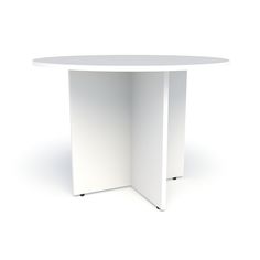 a white round table sitting on top of a white floor