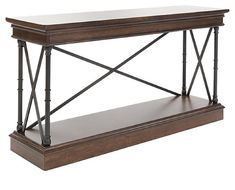 a wooden table with metal legs and a shelf on the top that has an iron frame