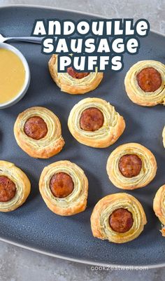 an image of sausage puffs on a pan with dipping sauce in the background and text overlay that reads, andoulie sausage puffs