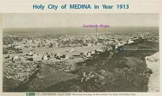 an old black and white photo of a city from the top of a hill in india