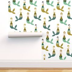 a wallpaper with mermaids and leaves on it in the corner of a room