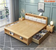 a bed with two drawers underneath it in a room that has blue walls and hardwood floors