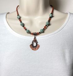 "This pretty boho chic necklace, with a bit of a rustic vibe, is one of my favorites! It features a rustic antique copper pendant, matte turquoise green Czech Picasso glass bicone beads etched with a copper wash, burnt orange Czech glass beads, tiny copper seed beads, and antique copper accents.  This necklace is perfect to wear with those favorite pair of jeans! Necklace closes with a lobster clasp.  Including the clasp, necklace length is 16-1/2\" and extends to 18-1/2\"  with the extender cha Adjustable Bohemian Copper Necklace, Bohemian Adjustable Patina Necklace, Bohemian Brown Jewelry With Patina, Bohemian Copper Necklace With Patina, Rustic One-of-a-kind Festival Necklaces, Rustic Patina Jewelry For Festival, Bohemian Rust-colored Copper Jewelry, Rustic Pendant Necklaces For Jewelry Making, Rust-colored Bohemian Copper Jewelry