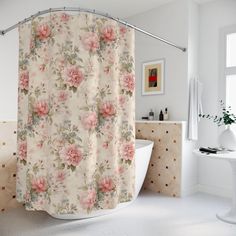 a shower curtain with pink flowers on it in a white bathtub next to a window