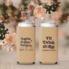 two can coolers sitting next to each other with flowers in the background