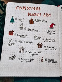 a christmas bucket list in a notebook with doodles on the page and other things to do