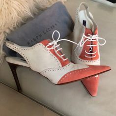 I Have Held Onto These Wanting To Wear Them And I Just Haven’t Had The Opportunity. They Are In Perfect Unworn Condition. Extra Heel Taps Provided These Are The Ralph Lauren Collection, Made In Italy Sling Back Spectators In A Beautiful, Coral, Salmon, Pink, And Super Soft Suede Leather. Self Tie Front. These Fit Like A Glove And Are So Beautiful. Includes Dust Bag. White Heels With Heel Strap For Work, White Open Heel Heels With Leather Sole, White Slingback Heels With Branded Insole, Designer White Slingback Heels, Elegant White Lace-up Heels, Elegant Ralph Lauren Round Toe Heels, Ralph Lauren Formal Heels For Spring, Ralph Lauren Elegant Formal Heels, Ralph Lauren Formal Spring Heels