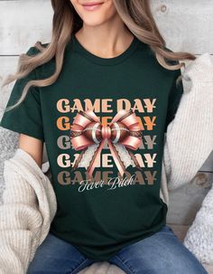 Game Day Football Shirt. Get ready for kickoff with this "Game Day" t-shirt, perfect for football fans, football games, or casual outings.  This shirt is a must-have for any true football enthusiast. Wear it proudly and let everyone know that it's game day. This classic unisex jersey short sleeve tee fits like a well-loved favorite. Soft cotton and quality print make users fall in love with it over and over again. These t-shirts have-ribbed knit collars to bolster shaping. The shoulders are tapered for a better fit over time. Dual side seams hold the garment's shape for longer. .: Made with 100% Airlume combed and ring-spun cotton, a lightweight fabric (4.2 oz/yd² (142 g/m that is easy to layer, breathable. Perfect for active and leisure wear.  .: Bella+Canvas manufactures all its products Green Fan Apparel T-shirt For Game Day, Green T-shirt With Letter Print For Football Season, Green T-shirt With Team Name For Game Day, Green T-shirt With Sublimation Print For Football Season, Green T-shirt For Game Day, Green T-shirt For Game Day With Team Spirit, Green Football Season Sports Fan T-shirt, Green Sports Fan T-shirt For Football Season, Game Day Green T-shirt With Team Spirit Style