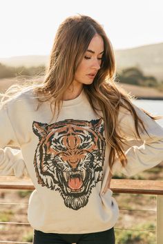 Such a great graphic print! This soft pullover features the iconic, vintage-inspired tiger graphic infused with a touch of bold color. The Roar tiger sweatshirt in sand is adorable worn alone or layered with your favorite black blazer. Can be worn at any age, graphic is timeless! It's everything you expect and more! It feels soft and comfy, it is oversized, model is wearing a small. This sweatshirt is printed using high quality ink only on a soft and durable **Unisex** sweatshirt with 100% cotto Childrens Shop, Vintage Tiger, Tiger Graphic, Beach Collection, Spirit Wear, Cute Sweatshirts, Top Graphic Tees, Bold Color, Black Blazer