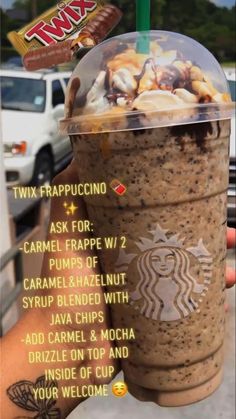 a person holding up a starbucks drink with information about the toppings on it's cup