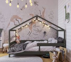 a child's bedroom decorated in grey and white with deers on the wall