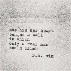 a black and white photo with the words she hid her heart behind a wall in which only a real man could climb