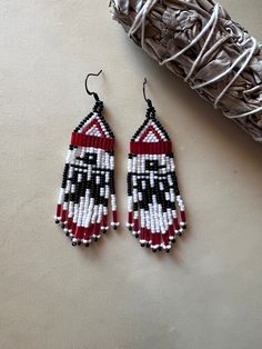 the beaded earrings are on display next to an object