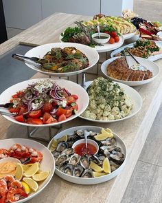 a table topped with plates filled with different types of food