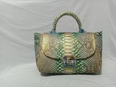 Genuine python skin top handle bag Color: lime multicolored Size: 23/16/13 cm (9.05/6.29/5.11 inches) Handmade in Bali with lots of love Please note this is a made to order item and it usually takes us from 7-14 days to ship it depending on local Bali holidays and tailor capacity. We ship from Indonesia, if you want a faster delievery please choose express shipping If you need any adjusments, please feel free to message me Luxury Snake Print Satchel Bag, Luxury Rectangular Snake Print Bag, Luxury Snake Print Top Handle Bags, Luxury Snake Print Bag For Daily Use, Luxury Handmade Green Bag, Luxury Handmade Green Bags, Luxury Handmade Green Shoulder Bag, Luxury Green Handmade Shoulder Bag, Bali Holidays