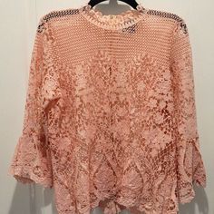 Large Bold Elements High Neck Embroidered Blouse Summer Long Sleeve Embroidered Lace Top, Long Sleeve Embroidered Lace Top For Summer, Spring Embroidered Orange Blouse, Orange Long Sleeve Blouse With Floral Embroidery, Long Sleeve Orange Top With Floral Embroidery, Orange Floral Embroidered Long Sleeve Top, Lace Tops With Floral Embroidery For Brunch, Feminine Spring Tops With Chikankari Embroidery, Feminine Chikankari Embroidery Tops For Spring