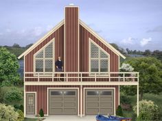 a two story house with three car garages on the front and second story above it