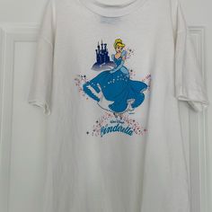 a white t - shirt with an image of cinderella on it