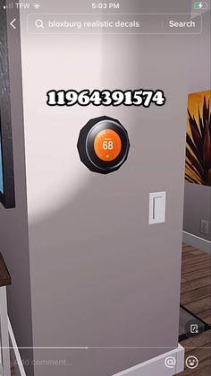 the door is open and there is an orange button in the center of the room