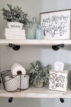 bathroom shelves with toilet paper, soaps and other items on top of each shelf