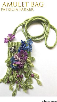 a necklace made out of beads with flowers on it