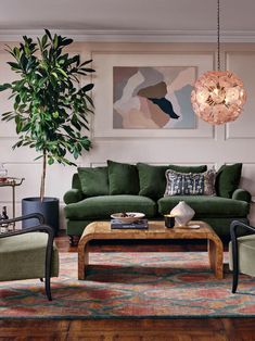 a living room filled with furniture and a green couch