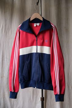 Adidas 1980's Vintage Track Jacket Made in France SIZE Shoulder：49cm Pit to pit：59cm Length：64cm Sleeve：63cm ◇Shipping is all from Asia, ◇All products are shipped by EMS, please include shipping costs. ◇Negotiate only accept payment with PAYPAL Welcome to our online store https://bansecondhandgoods.com/ Worldwide Shipping The official website provides credit card services, please contact us via private message if necessary. Find us IG: ban_secondhand_goods Thank you for checking us out :) Retro Long Sleeve Track Jacket For Winter, Retro Cotton Track Jacket For Winter, Vintage Red Track Jacket For Winter, Red Vintage Track Jacket For Winter, Red Vintage Winter Track Jacket, 90s Style Long Sleeve Track Jacket For Fall, Retro Track Jacket With Three Stripes, Retro Long Sleeve Track Jacket With Three Stripes, Vintage Long Sleeve Track Jacket For Winter