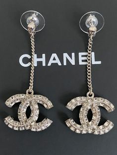 NIB Chanel Iconic Large CC Logo Crystal Chain Charm Silver Tone Drop Earrings Chanel Earrings Studs Silver, Designer Metal Jewelry For Evening, Designer Silver Chain Jewelry, Designer Jewelry For Party, Designer Sterling Silver Jewelry For Party, Designer Metal Jewelry, Luxury White Gold Metal Earrings, Designer Metal Jewelry With Matching Earrings, Designer Dangle Earrings For Parties