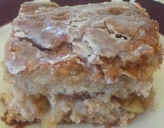 a close up of a piece of cake on a plate with frosting and icing