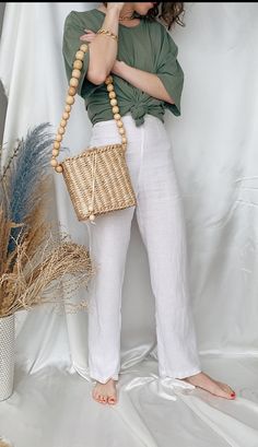 Chic Shoulder Bag With Bamboo Handle For Beach Season, Chic Beige Shoulder Bag With Natural Fiber, Chic Beige Shoulder Bag In Natural Fiber, Chic Beige Natural Fiber Shoulder Bag, Beach Shoulder Bag With Bamboo Handle In Cream, Chic Jute Shoulder Bag With Bamboo Handle, Cream Shoulder Bag With Bamboo Handle For Vacation, Chic Natural Shoulder Bag With Bamboo Handle, Chic Natural Fiber Shoulder Bag With Bamboo Handle