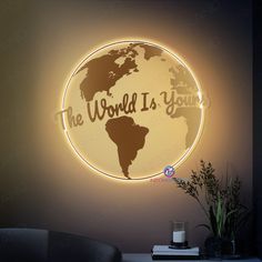 the world is yours illuminated sign in a living room