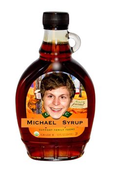 a bottle of michael syrupp syrup with an image of a young man on it