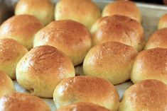 freshly baked bread rolls on a baking sheet ready to go into the oven in the oven