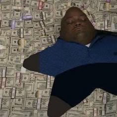 a man laying on top of a bed covered in lots of dollar bill bills with his eyes closed