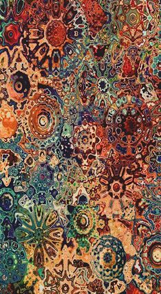 an abstract painting with lots of different colors and patterns on it's surface, including circles